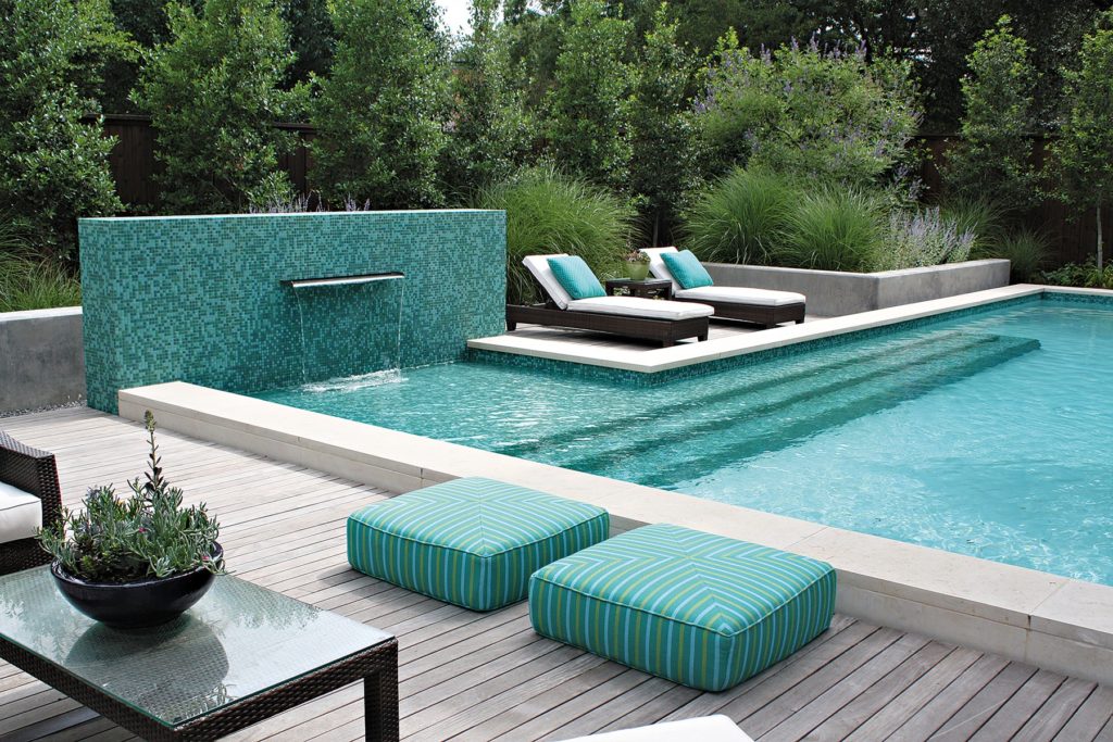 impressive-outdoor-swimming-pool-with-sheet-waterfall-and-twin-lounge-pool-chairs-also-wooden-pool-deck-ideas-pool-deck-ideas-architecture-ideas-exteriors-how-to-decorate-your-swimming-pool-with-att